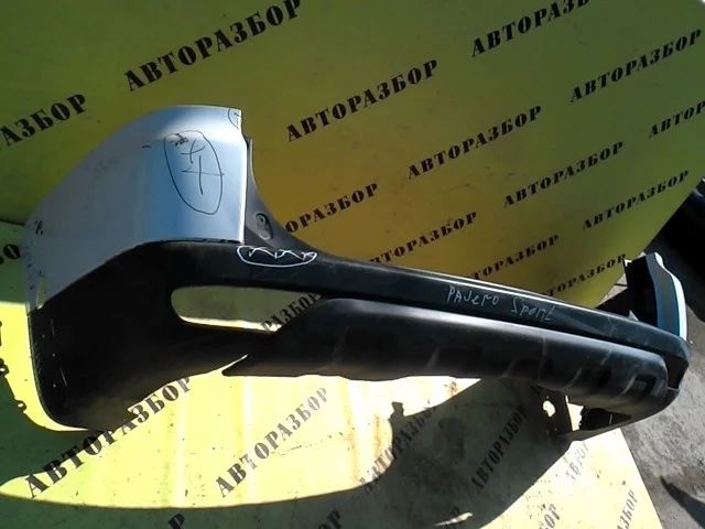 Бампер задний MITSUBISHI PAJERO SPORT (KH) 2008-2015 6410B193WA