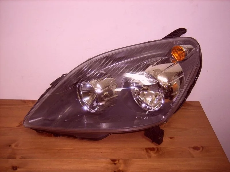 Фара черная левая новая неориг. Опель Зафира Б