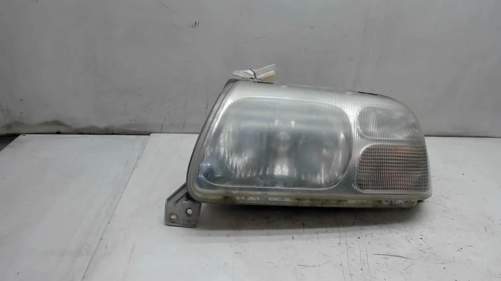 Фара левая до 2002 Suzuki Grand Vitara