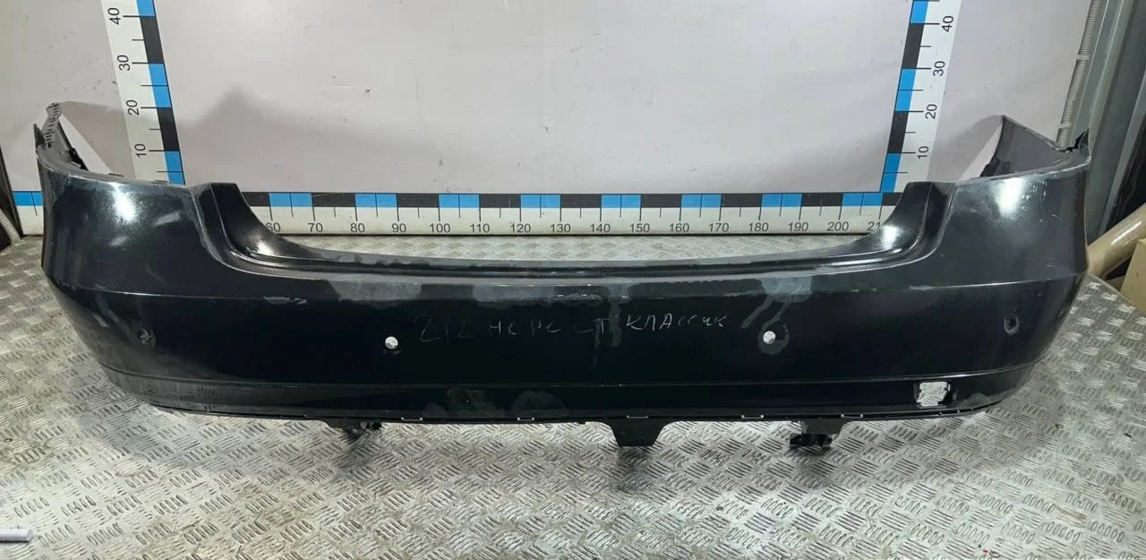 [Б/У] Бампер задний (под парктрон, до 2013г) Mercedes W212 - дефект левого внутреннего крепления, сломано крепление слева снизу [Незначительные дефекты] [Код: 00591011 ]