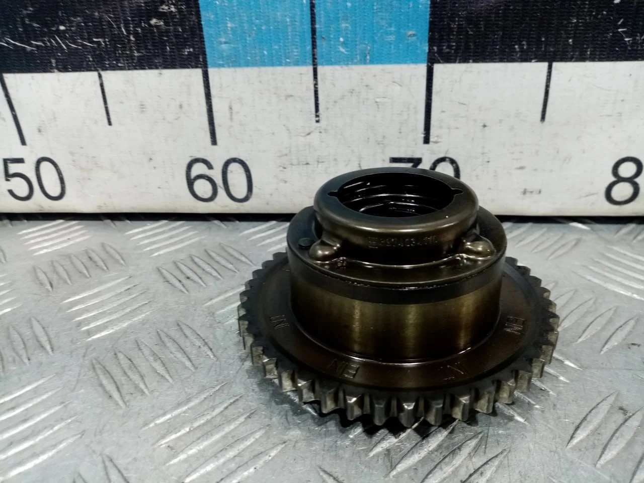 [Б/У] Механизм изменения фаз ГРМ впуск - Незначительные царапины [Незначительные дефекты] [Код: 00591852 ]