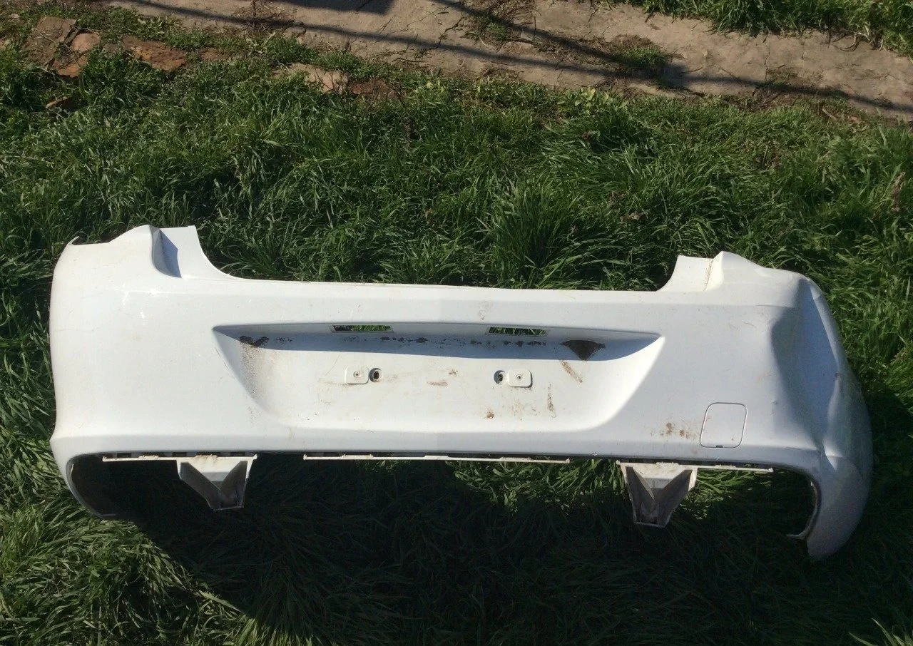Бампер Opel Astra 13368066, задний
