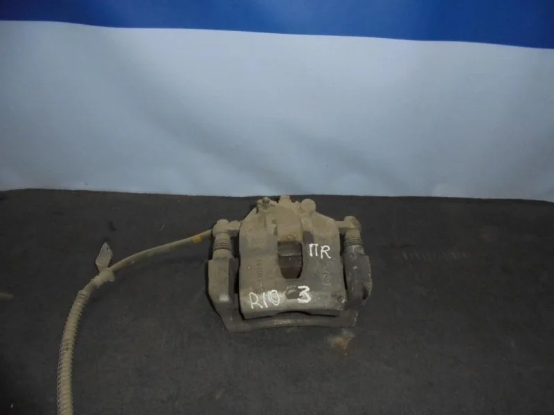 Суппорт тормозной Kia Rio 3 581901RA00, передний правый