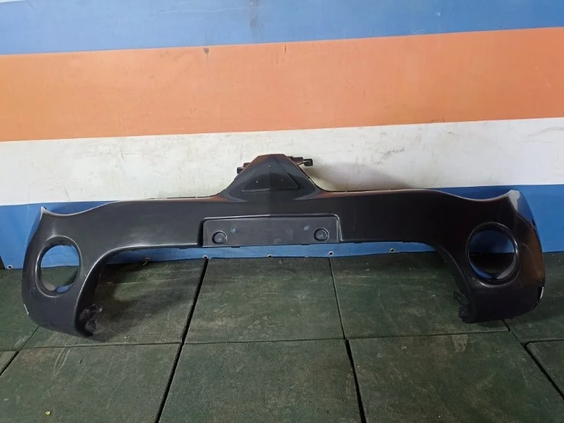 Бампер Mitsubishi L200 2004-2015 STMB93000A0, передний