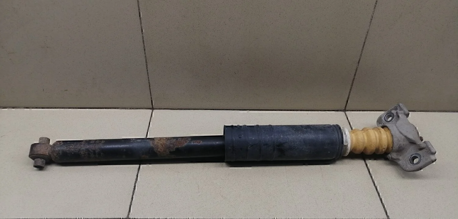 Амортизатор задний Aveo (T300) 2011>