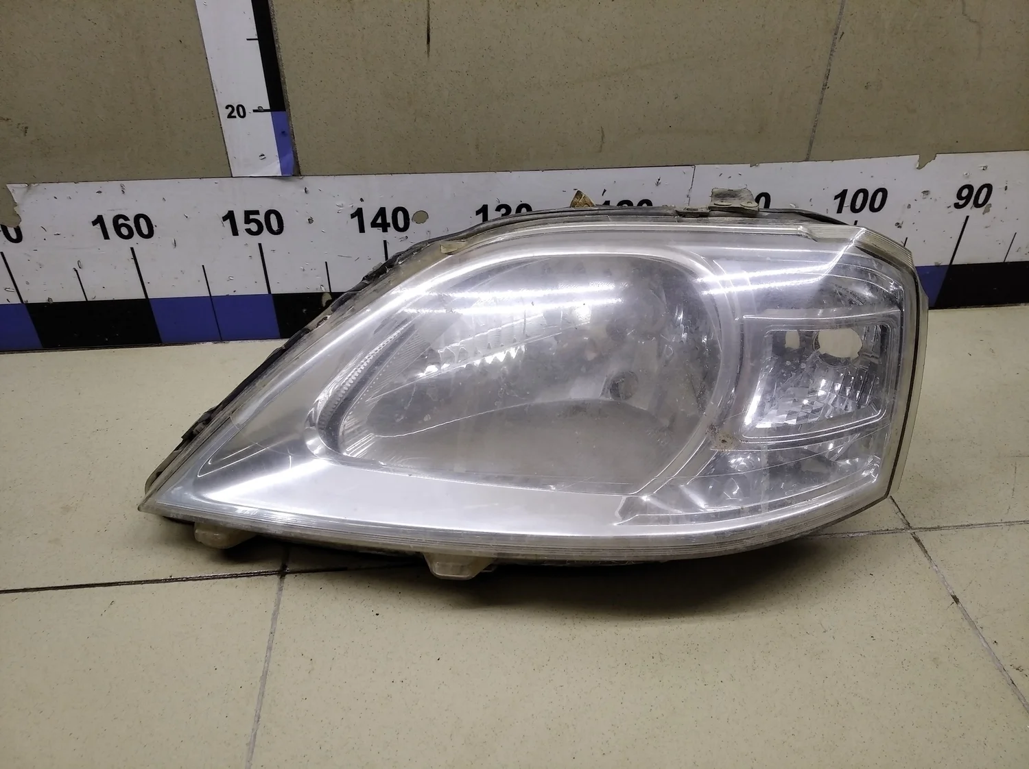 Фара левая Logan 2005-2014