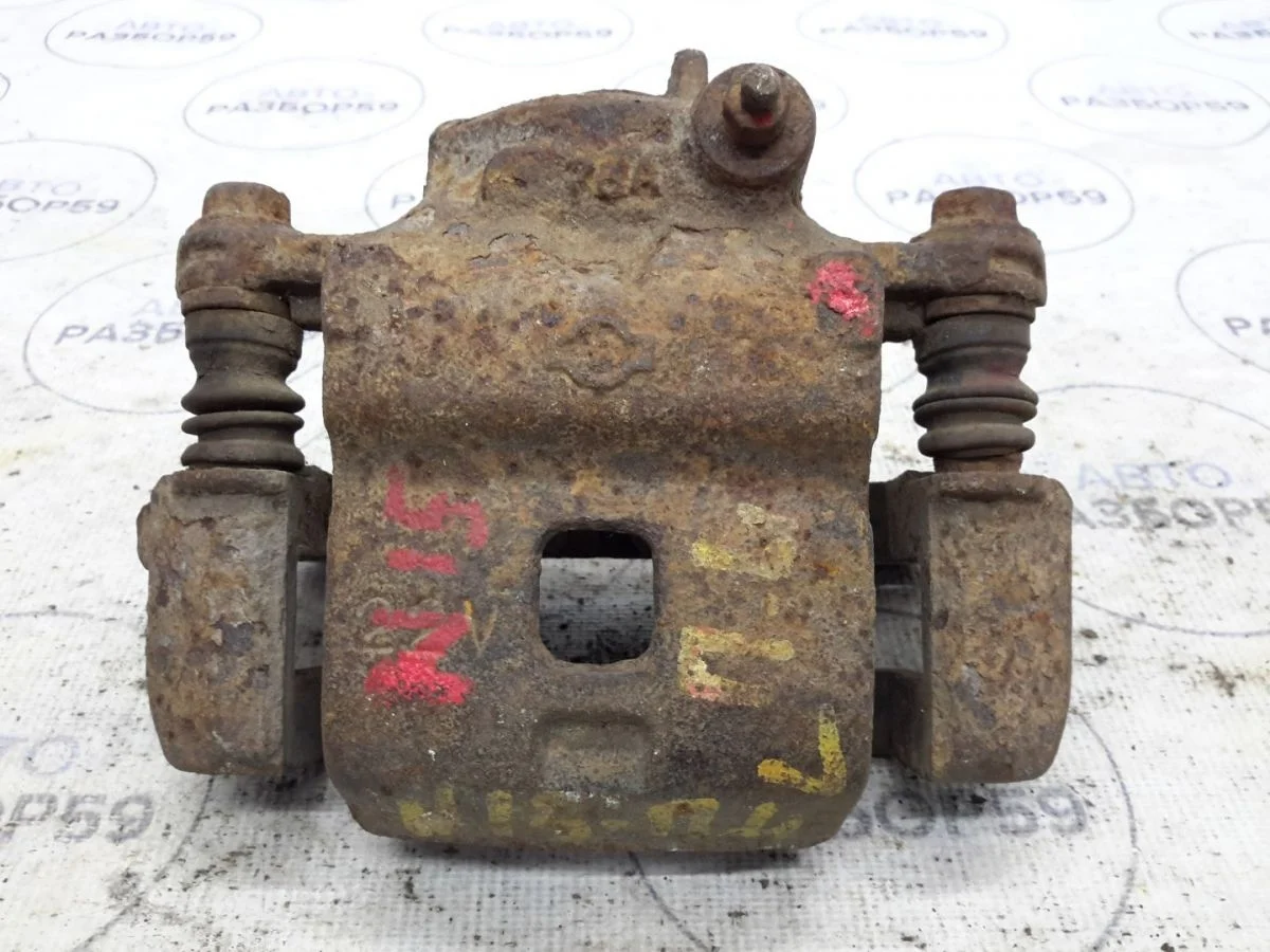 Суппорт передний левый Nissan Almera N15 (1995—2000)