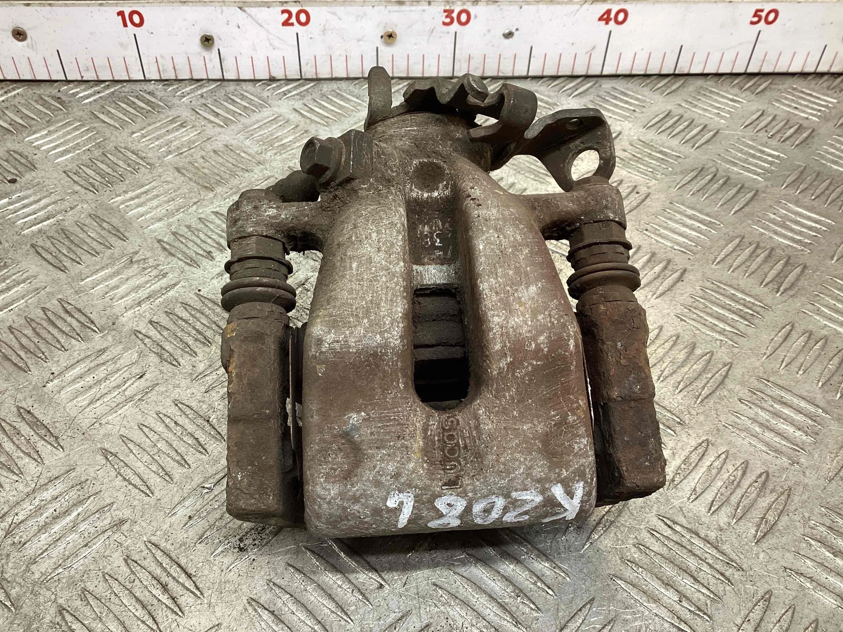 Суппорт задний левый Opel Astra Astra H 2007-2010 рестайлинг 2009 1,6 Бензин МКПП 5ст. Хэтчбек 5дв.