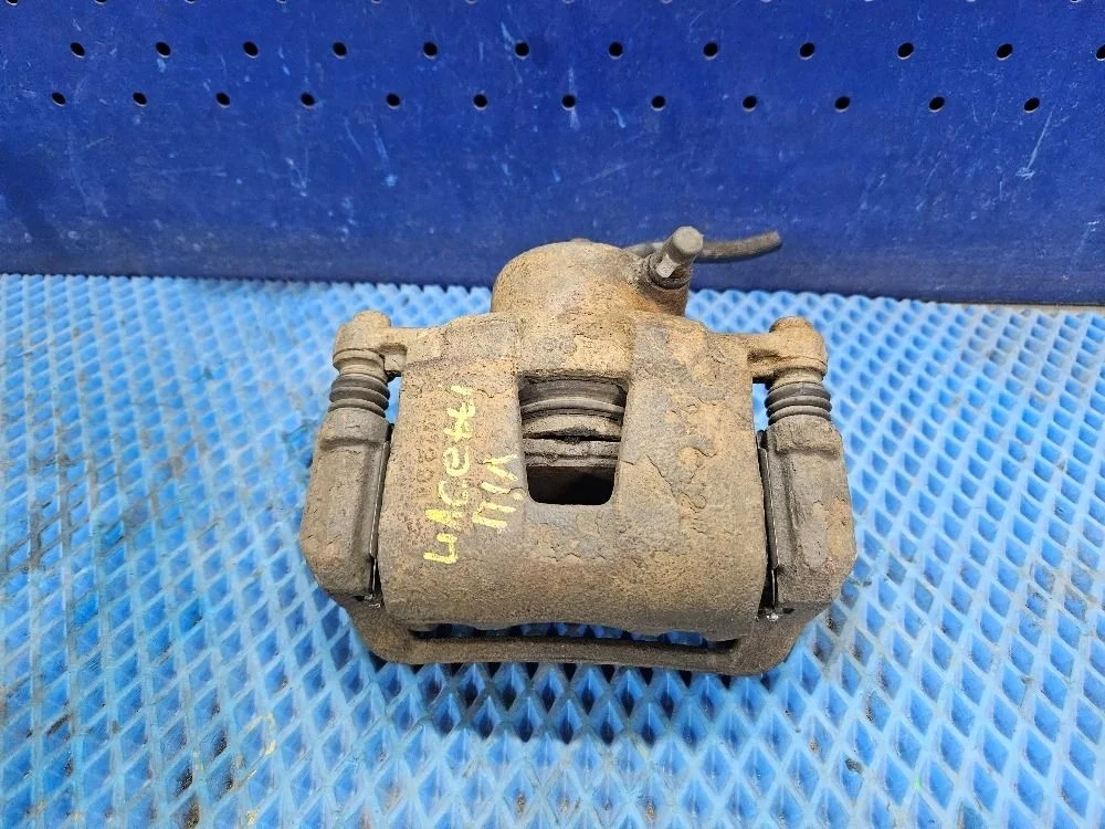 Суппорт тормозной передний левый Chevrolet Lacetti I (2004—2013) б.у