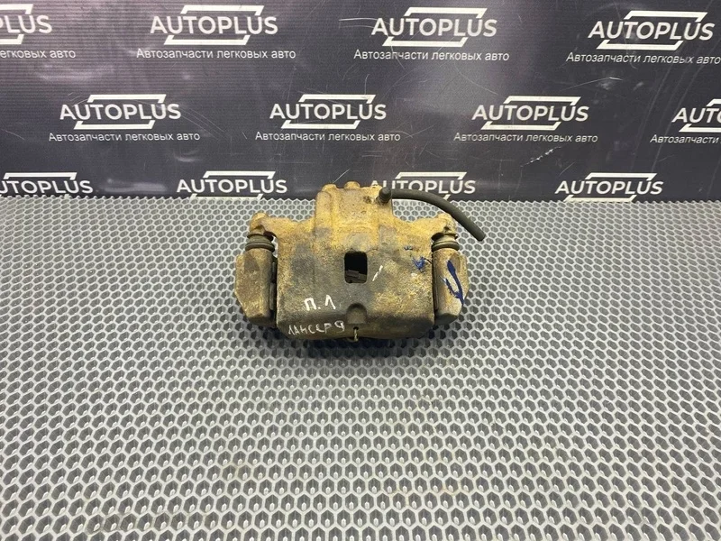 Суппорт тормозной Mitsubishi Lancer 2007 MR955063 СЕДАН 4G13, передний левый