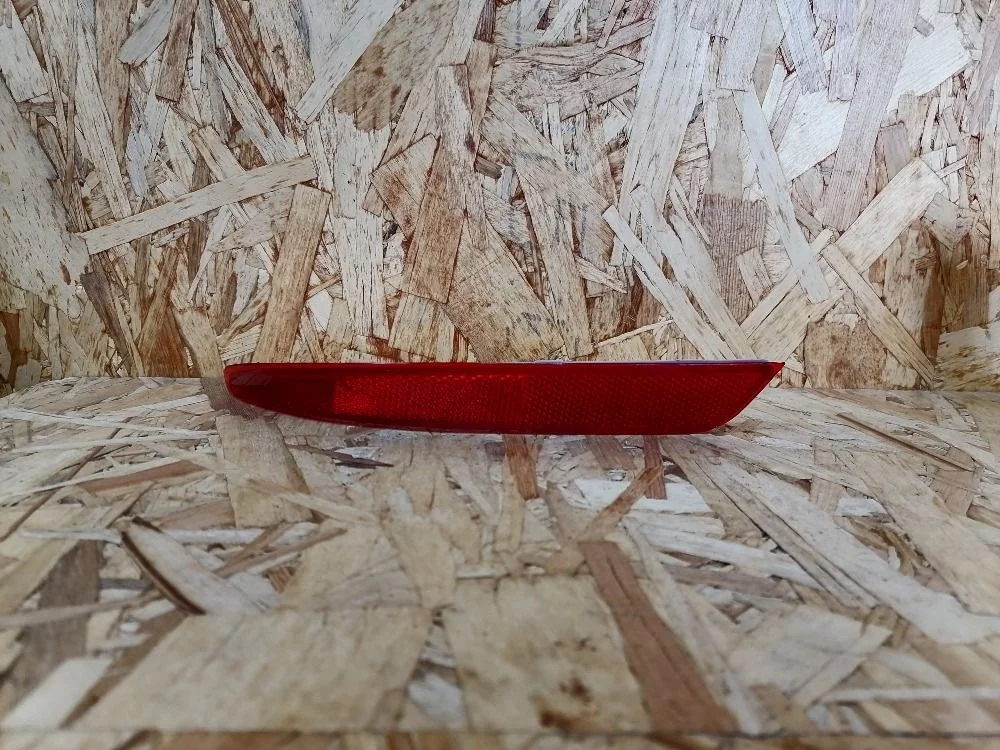 Отражатель в бампер задний левый Nissan Almera G15 (2012—2018) 26565EW000