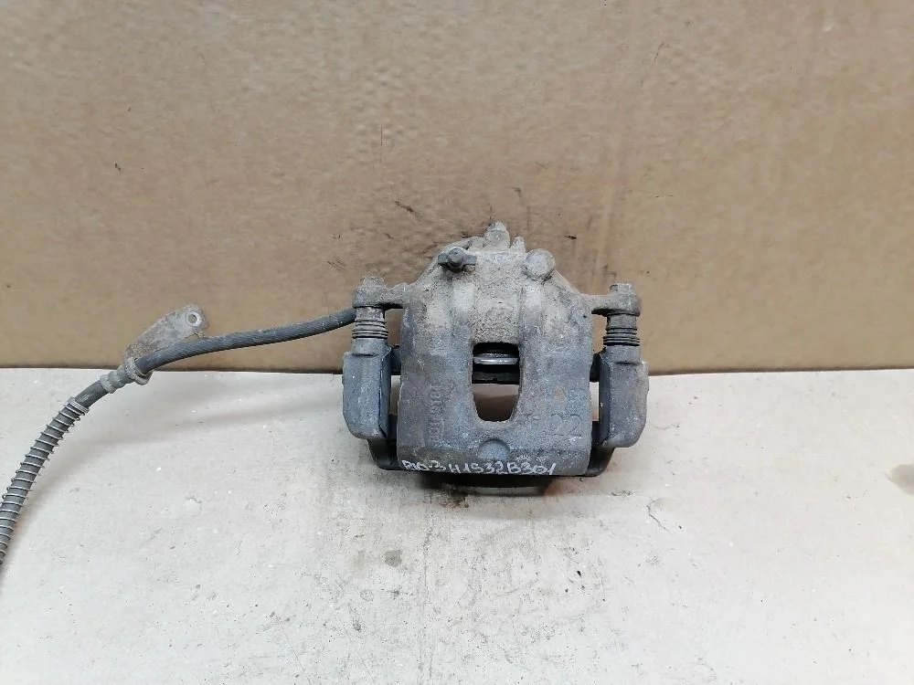 Суппорт тормозной передний правый Kia Rio III (2011—2015) 581304L000