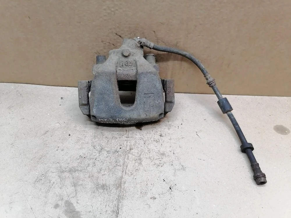 Суппорт тормозной передний левый Mazda 3 BK (2003—2006) BPYK3371XA