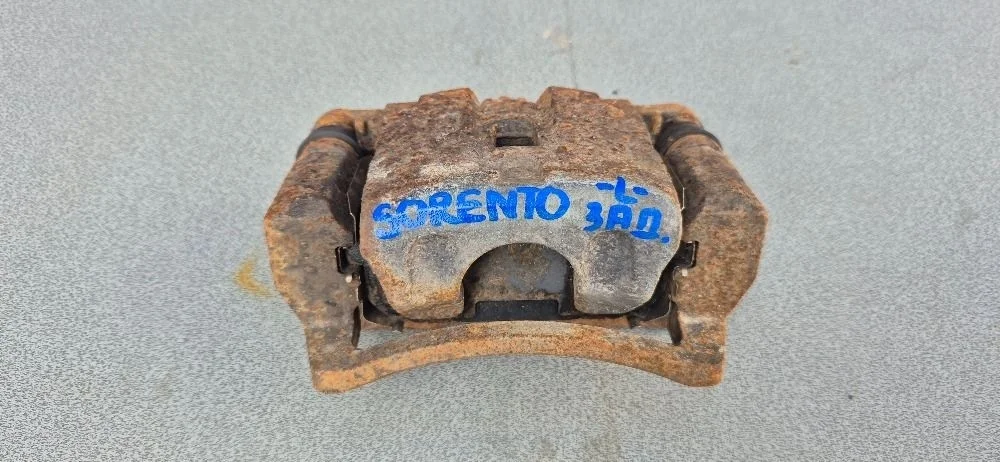 Суппорт тормозной задний левый для Kia Sorento 1