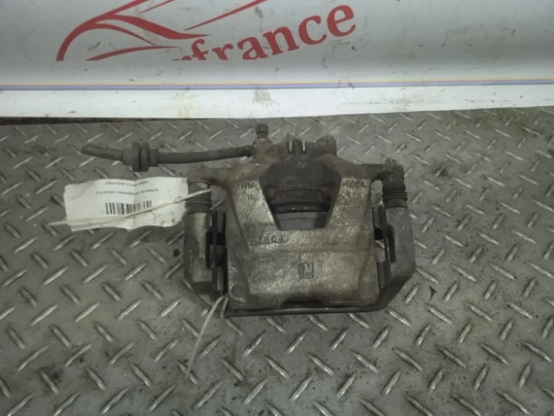 Суппорт тормозной Chevrolet Cruze 13301190 1, передний правый