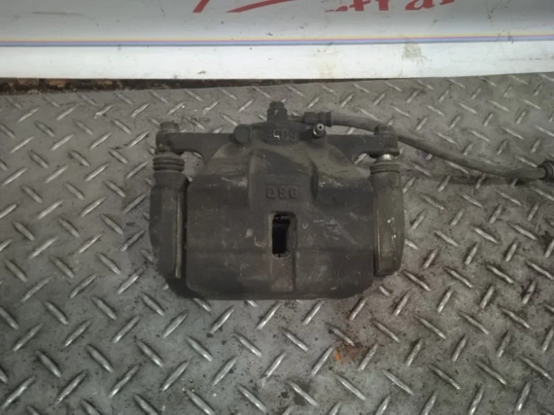 Суппорт тормозной Nissan X-trail 41011JD00A T31, передний левый