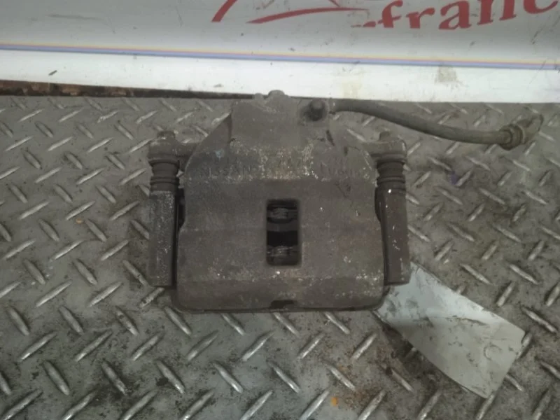 Суппорт тормозной Nissan Almera 410112F522 N16, передний левый