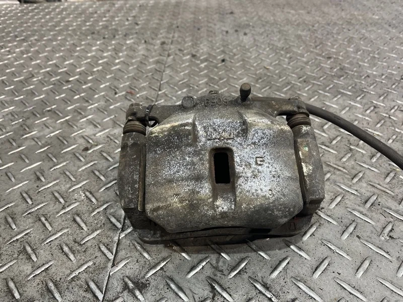 Суппорт тормозной NISSAN X-Trail 2007-2011 41011JD00A T31, передний левый