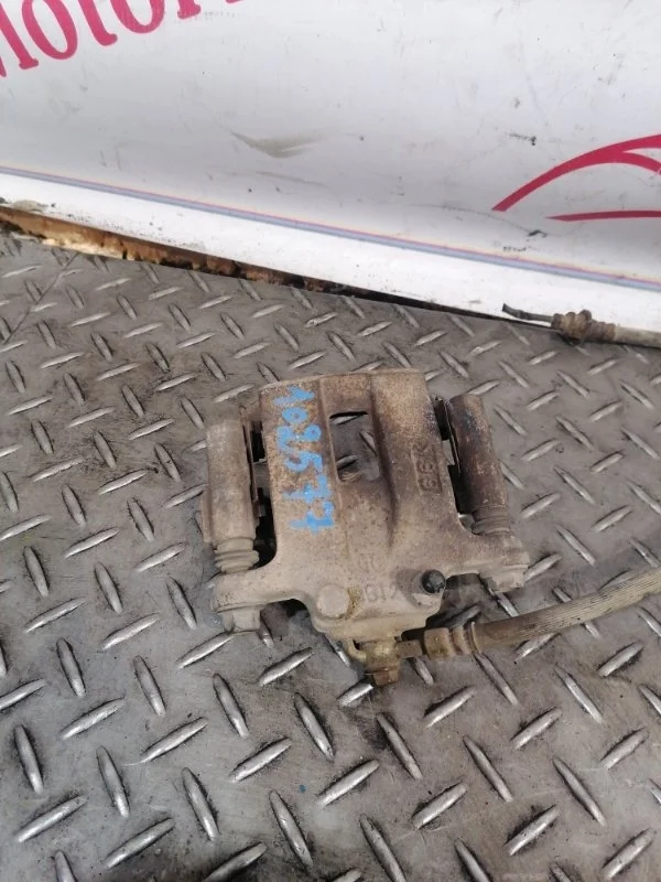 Суппорт тормозной Nissan X-Trail 440118H30A T30, задний левый