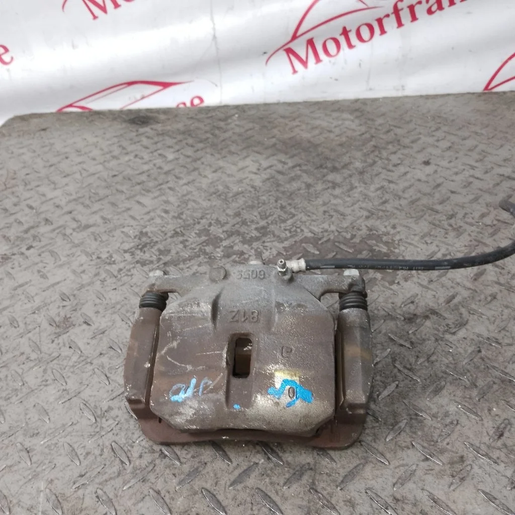 Суппорт тормозной Nissan Qashqai 41011JD00A J10, передний левый