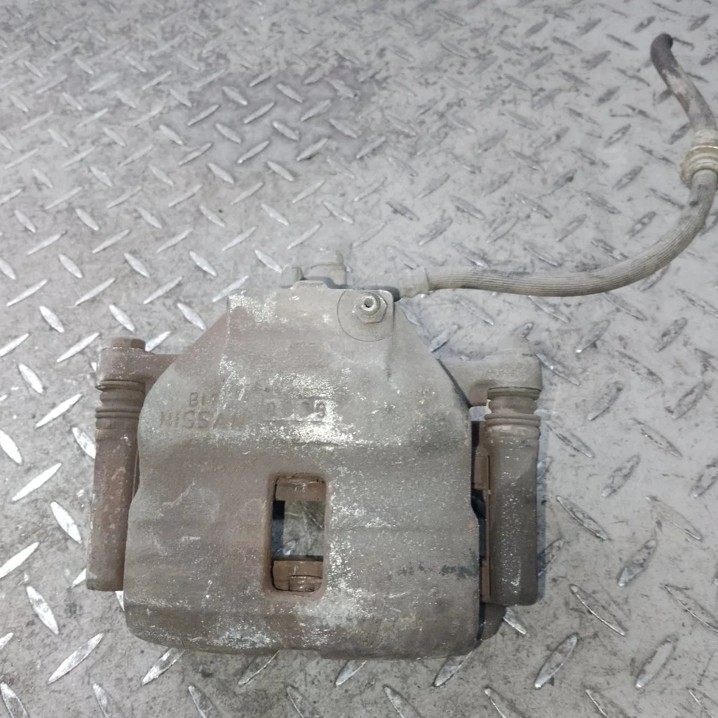 Суппорт тормозной Nissan Almera 410112F522 N16, передний левый