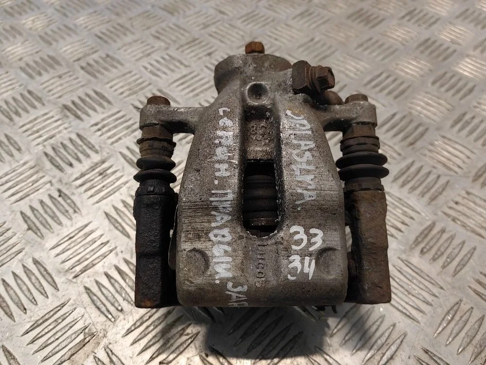 Суппорт задний правый Opel Astra H