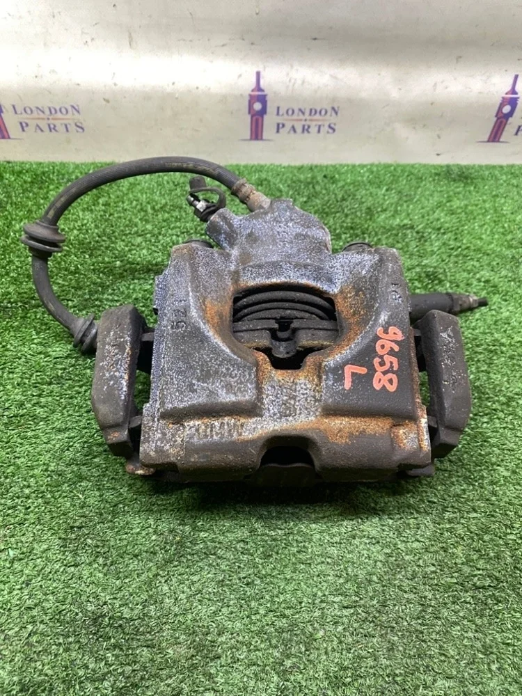 Суппорт тормозной BMW 320i E90