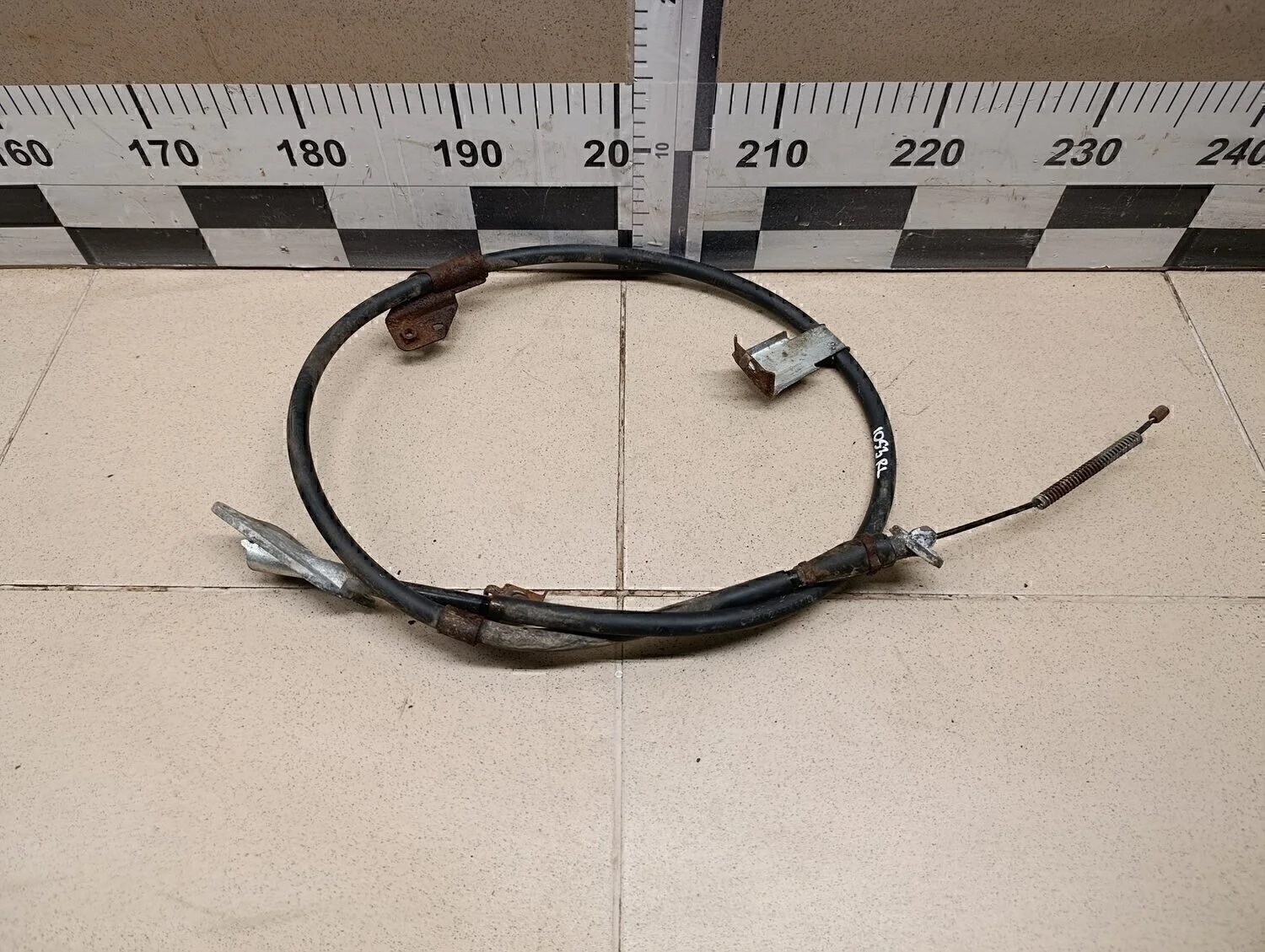 Трос стояночного тормоза левый Almera Classic (B10) 2006-2013