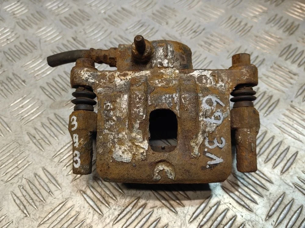 Суппорт тормозной задний левый Mitsubishi Lancer 9