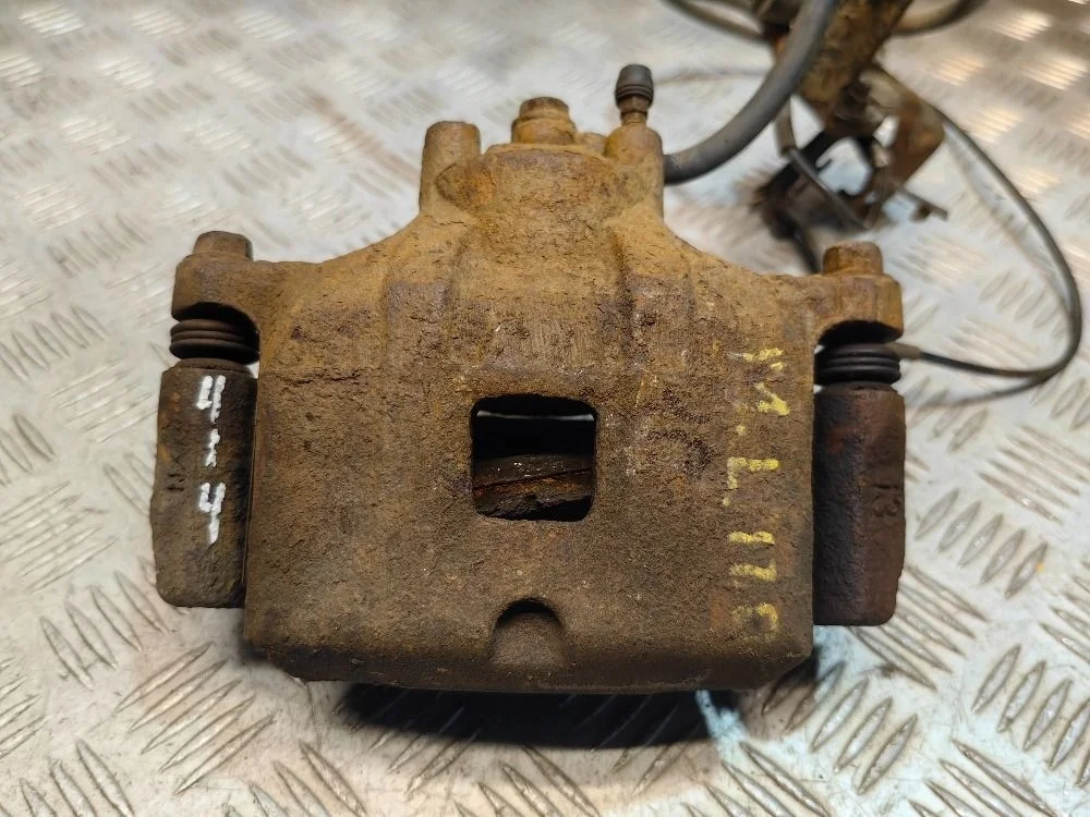 Суппорт передний левый Mitsubishi Lancer 10