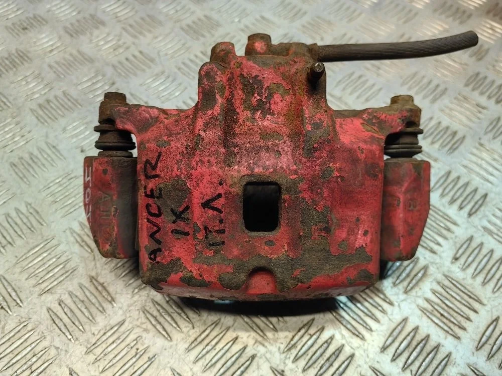 Суппорт передний левый Mitsubishi Lancer 9