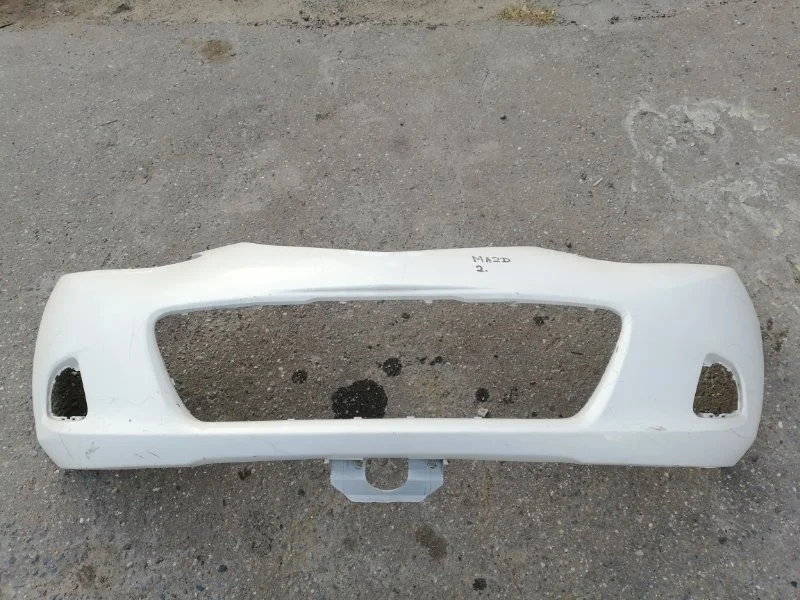 Бампер Mazda 2 2008 D65150031 DE, передний