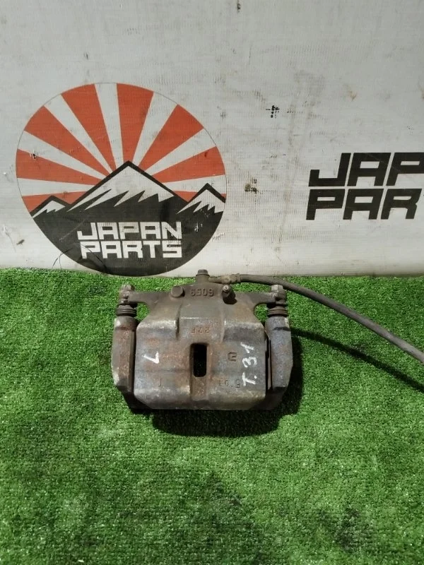 Суппорт Nissan X-Trail 41011JD00A T31, передний левый