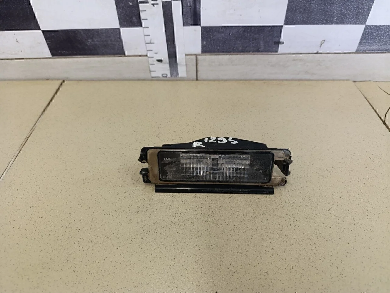 Фонарь подсветки номера Logan 2005-2014