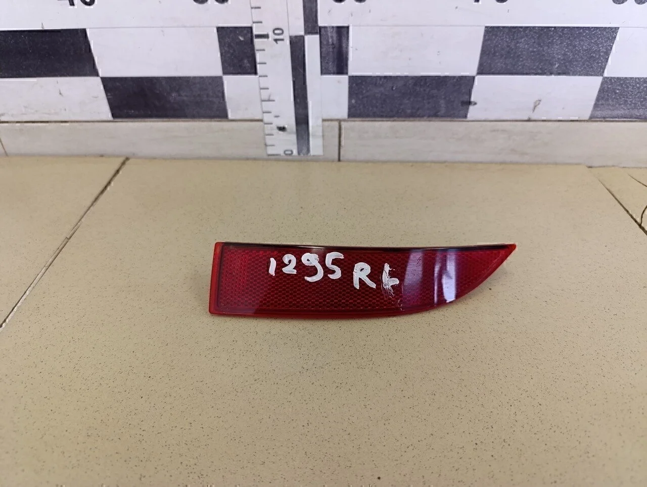 Отражатель в бампер задний левый Logan II 2014>