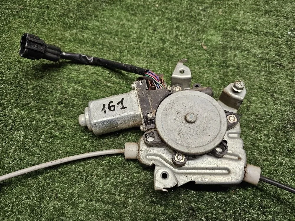 Моторчик стеклоподъемника перед левый Nissan Tiida