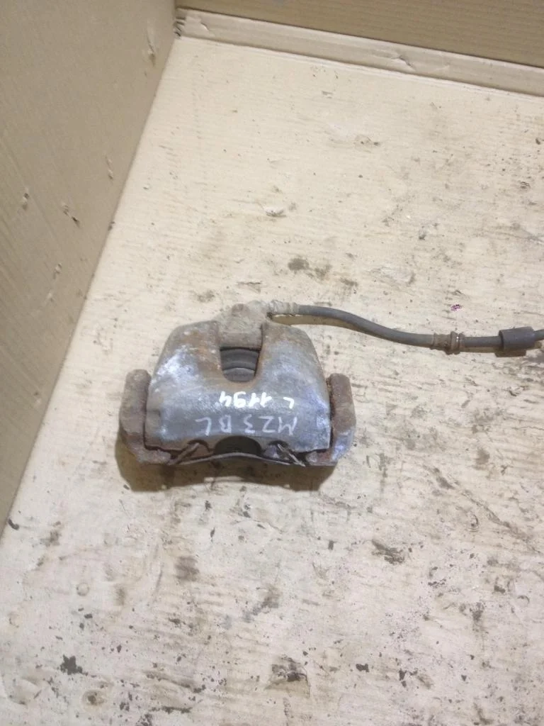 Суппорт передний левый Mazda 3 BL