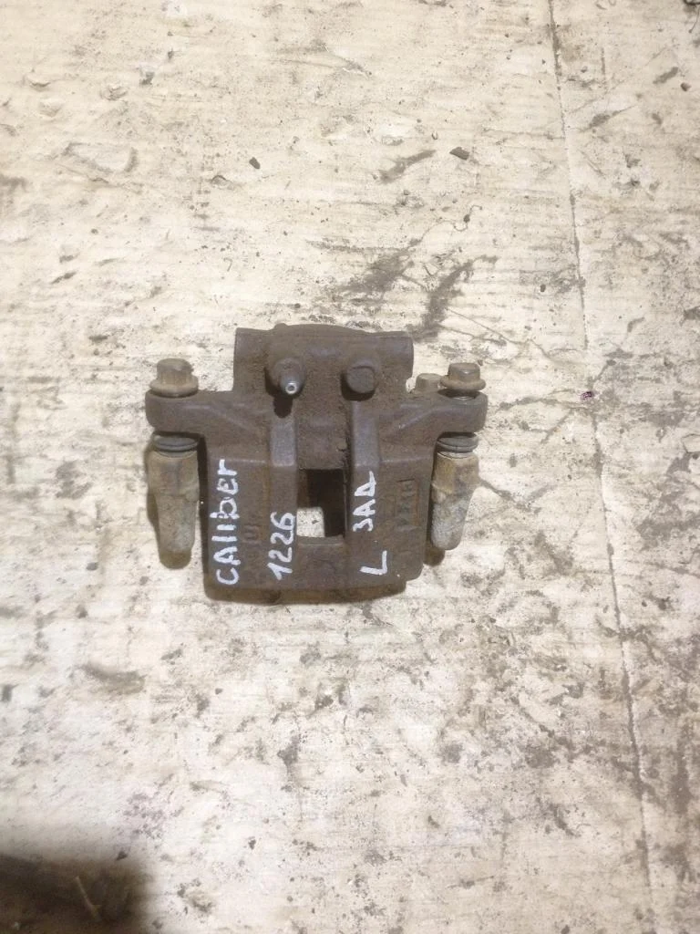 Суппорт задний левый Dodge Caliber PM