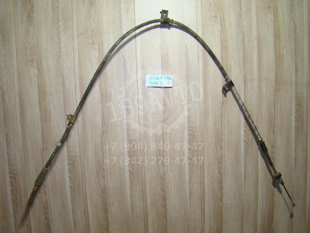 Трос ручника левый Hyundai Elantra HD