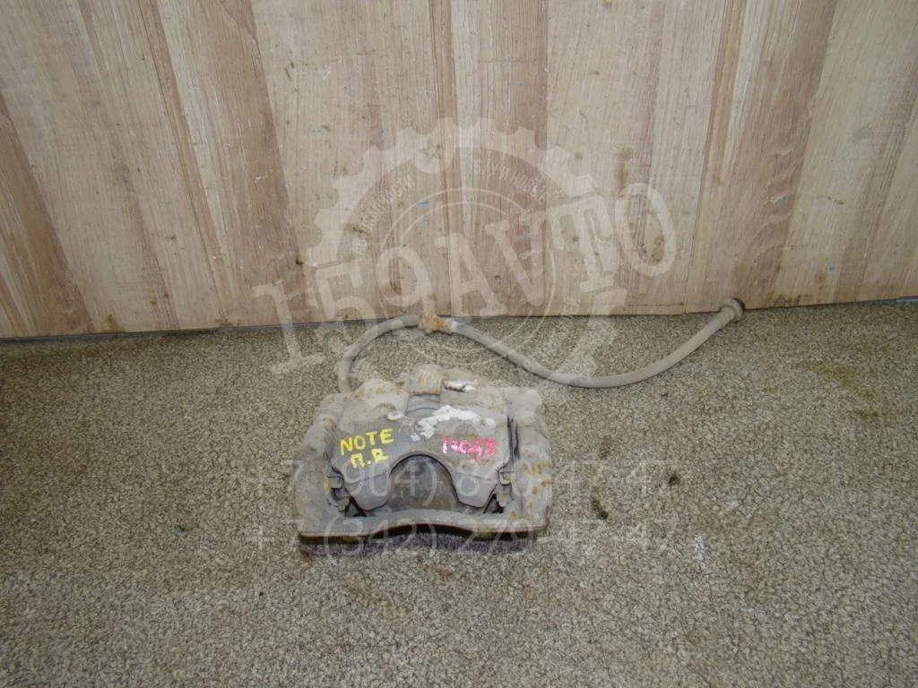 Суппорт передний правый Nissan Note 2008 E11