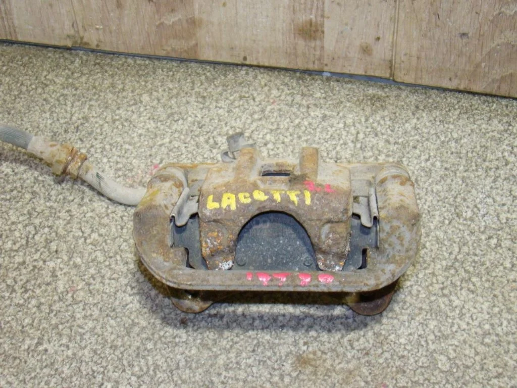 Суппорт задний левый Chevrolet Lacetti 2011 J200