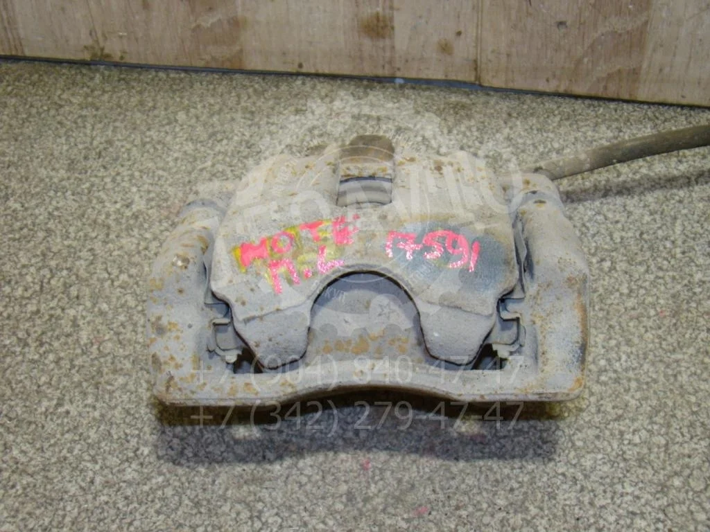 Суппорт передний левый Nissan Note 2008 E11