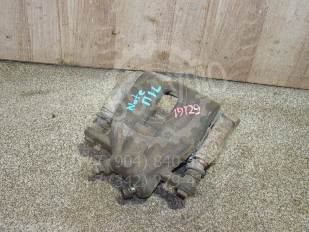 Суппорт передний левый Nissan Note E11