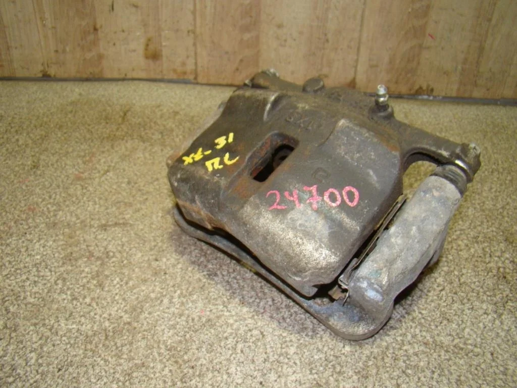 Суппорт передний левый Nissan X-Trail T31