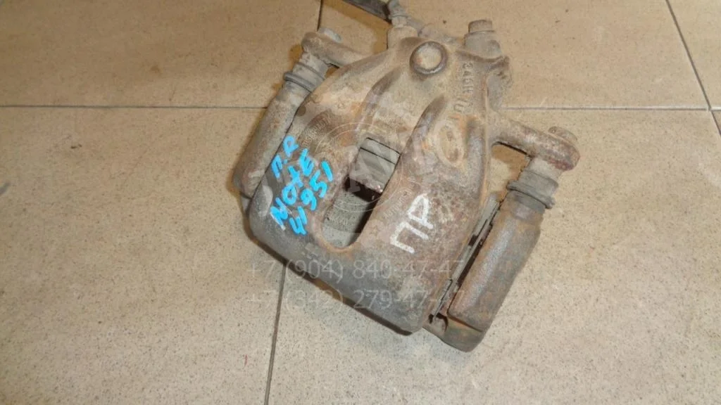 Суппорт передний правый Nissan Note E11