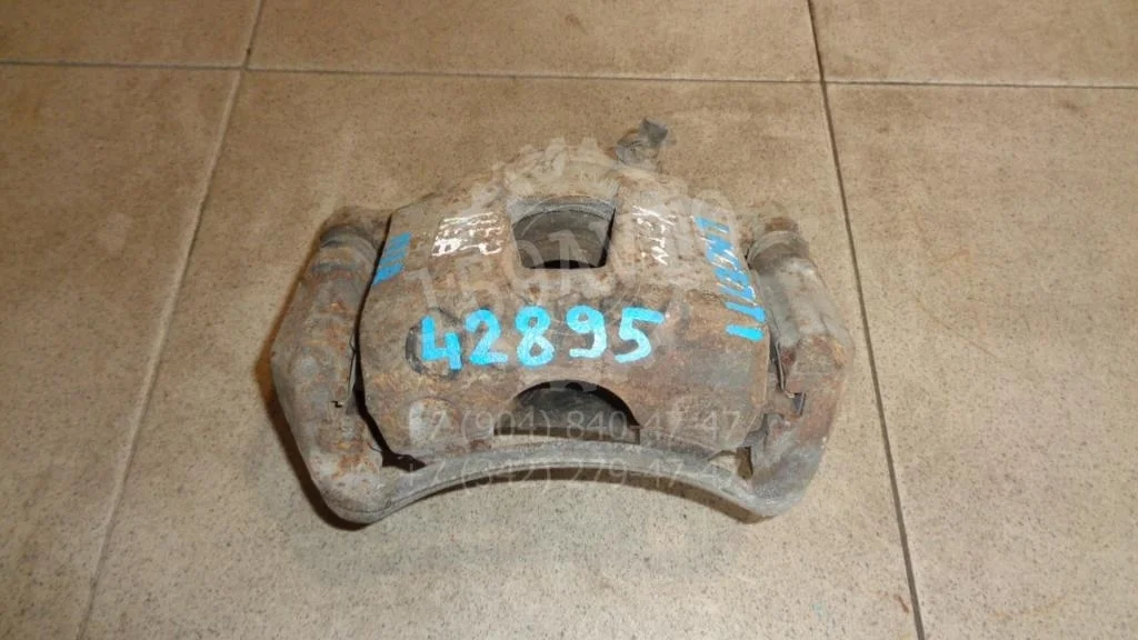 Суппорт передний левый Chevrolet Lacetti J200