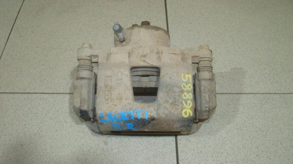 Суппорт передний правый Chevrolet Lacetti J200