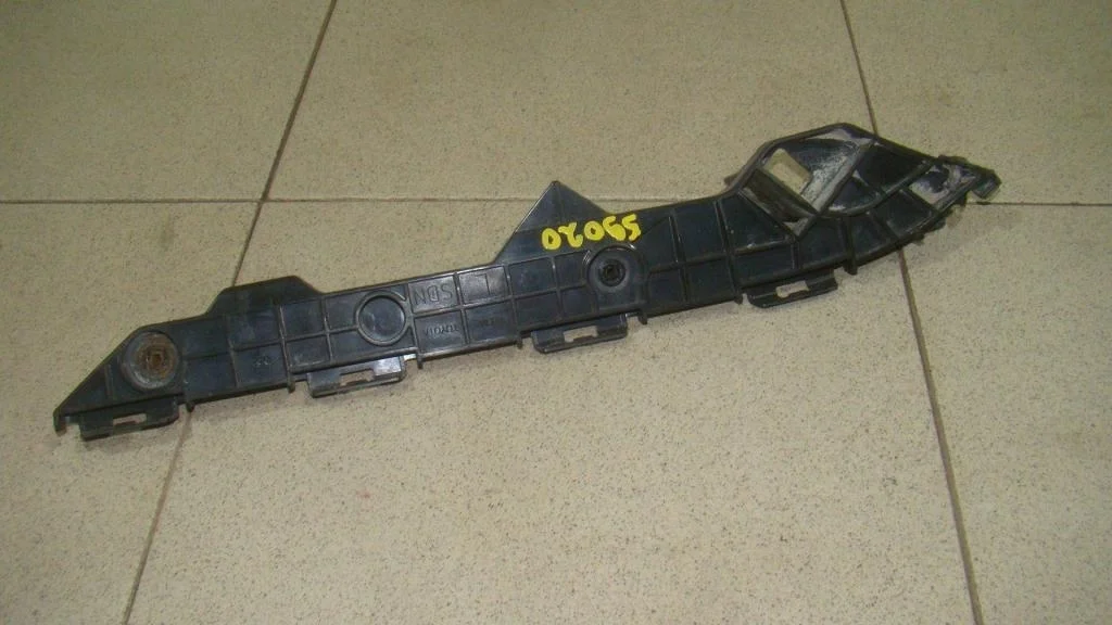 Кронштейн заднего бампера левый Toyota Corolla E150