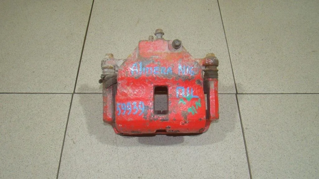 Суппорт передний левый Nissan Almera 2000 N16