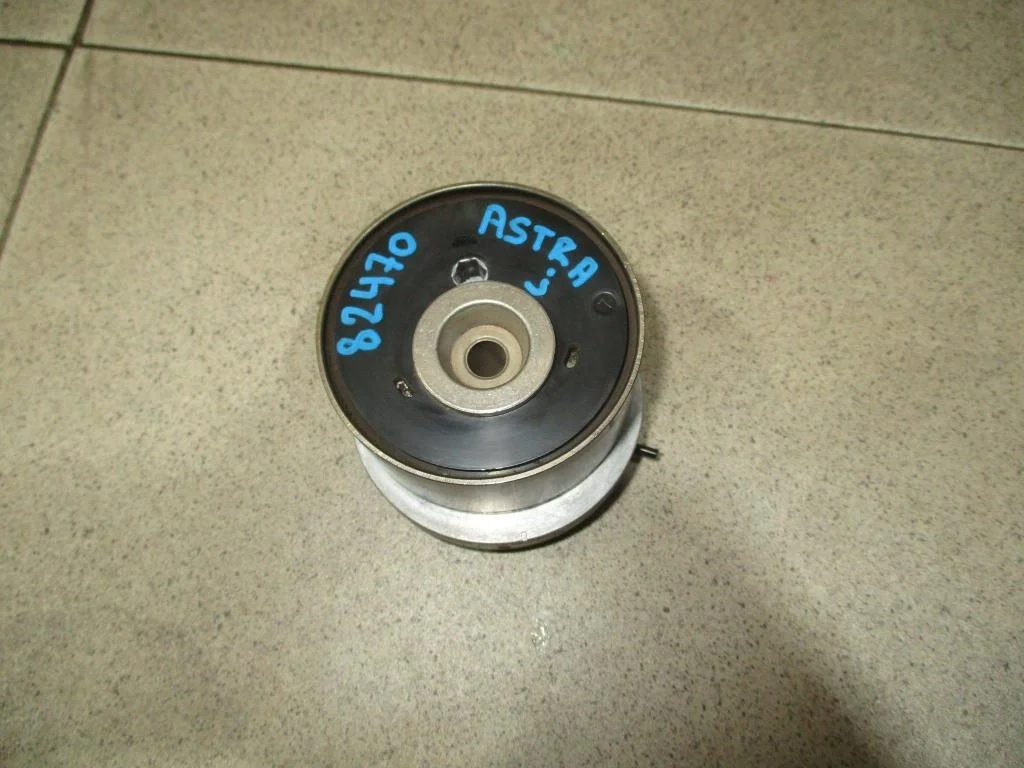 Ролик-натяжитель ремня грм Opel Astra J